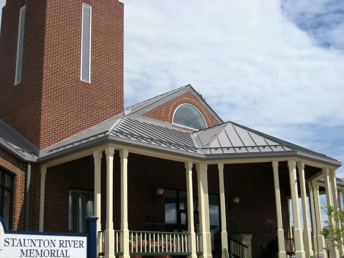 Skilled roofing craftsmen working on a residential roof in Michigan Bluff